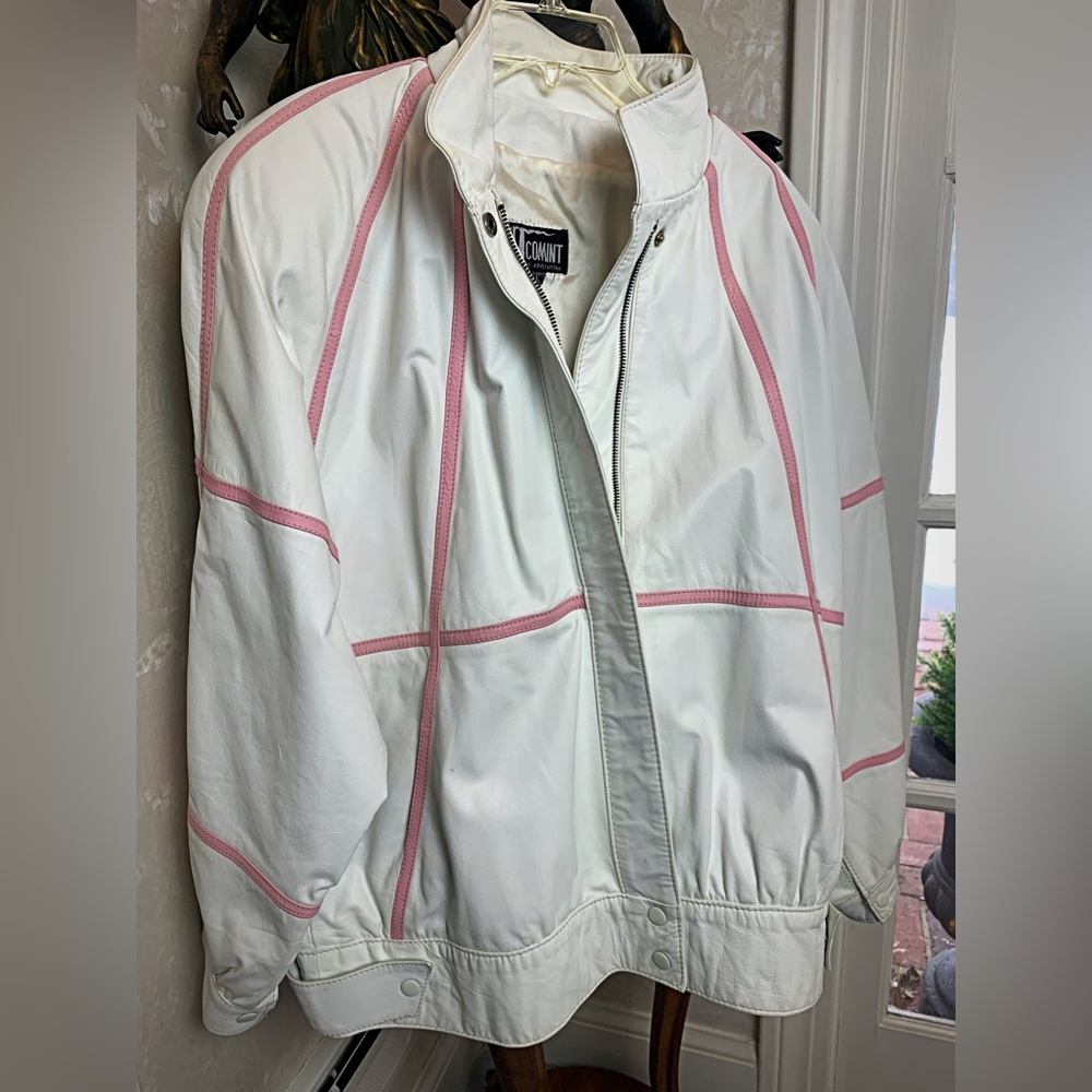 White leather coat with pink leather stripes by COMINT.